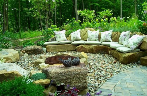 Install pebbles and river stones - beautiful landscape in the garden Install pebbles and river stones - beautiful landscape in the garden