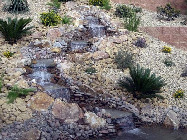 Install pebbles and river stones - beautiful landscape in the garden