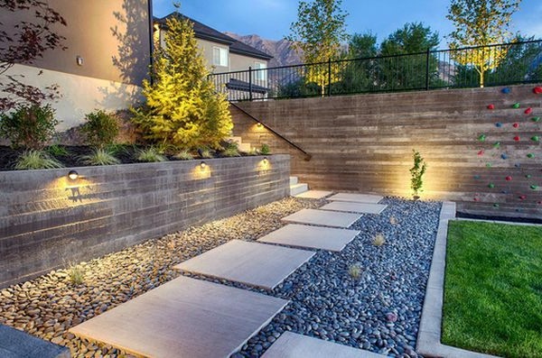 Install pebbles and river stones - beautiful landscape in the garden Install pebbles and river stones - beautiful landscape in the garden