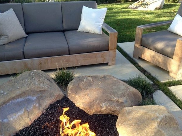 Install pebbles and river stones - beautiful landscape in the garden Install pebbles and river stones - beautiful landscape in the garden