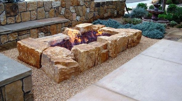 Install pebbles and river stones - beautiful landscape in the garden Install pebbles and river stones - beautiful landscape in the garden